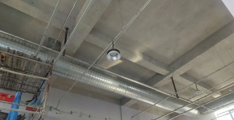 Compressed air lines installed along a factory ceiling