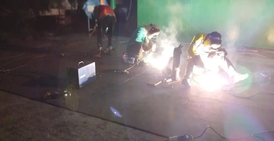 Night welding of new tank floor plates